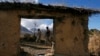 Pakistani army soldiers patrol near a government school that was torched by militants last year, in Pakka village in Kurram Tribal Agency December 18, 2012. The army wrestled back control of the area from militants during an operation in 2011, officials t