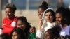 Nobel Peace Prize winner Malala Yousafzai is pictured with teenage girls from Complexo da Penha, who work with football organization Street Child United, at Copacabana beach in Rio de Janeiro, Brazil July 11, 2018.