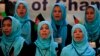 FILE - Girls sing the Afghan national anthem at an event in Kabul, Afghanistan, Sept. 26, 2013.