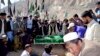 Members of the Hazara community bury the body of one of six coalminers, who were killed by unidentified gunmen on November 1, at a Hazara graveyard in Hazara town, Quetta November 2, 2013. One is a band of separatists fighting for independence from Pakis